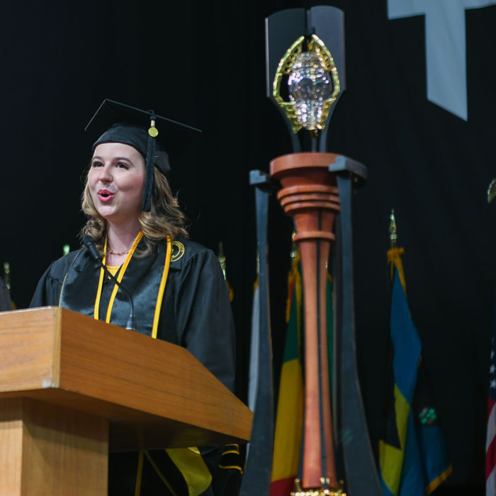 Graduate singing at Commencement