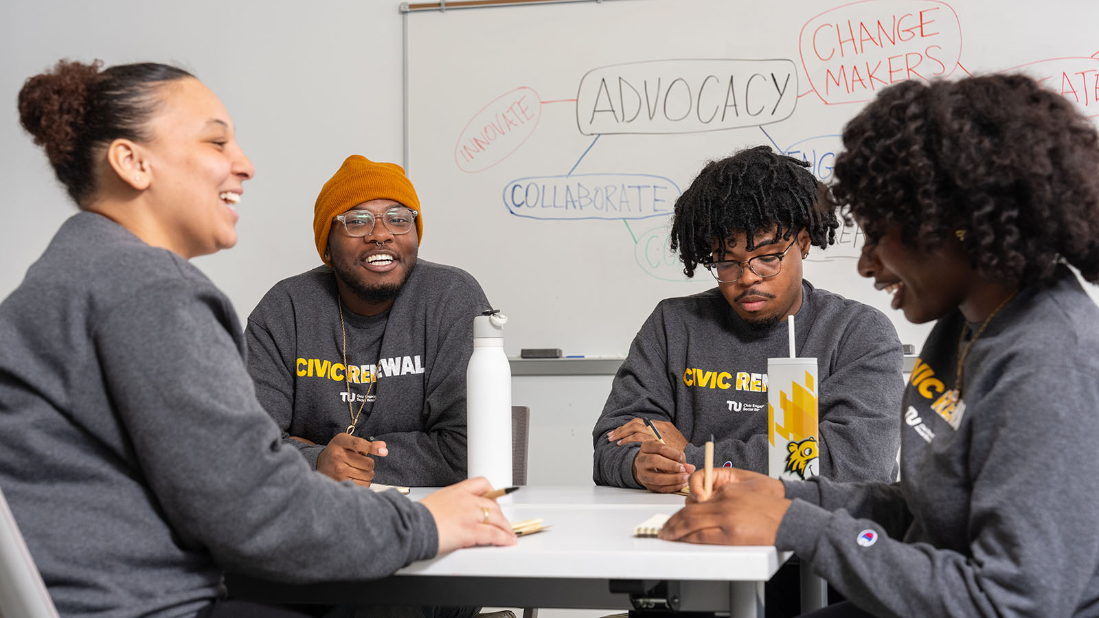 People sitting at a table talking about civic engagement