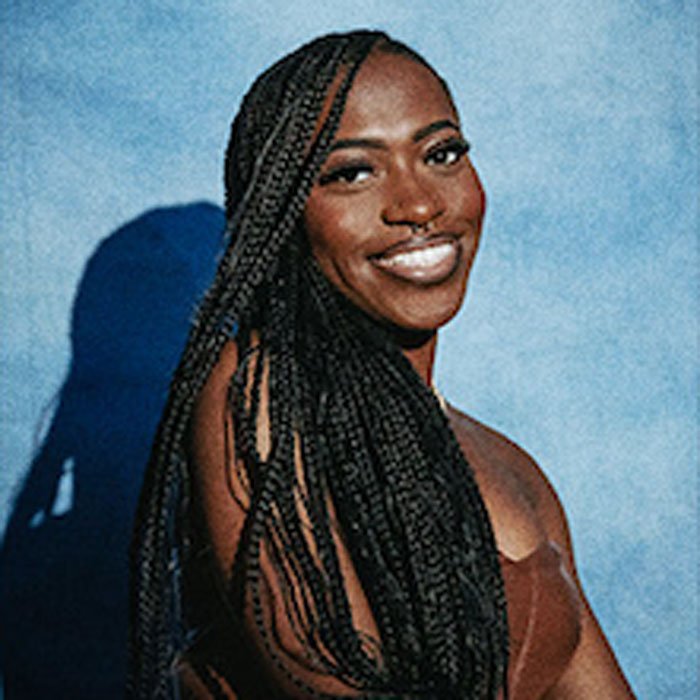 student sitting for BSU portrait