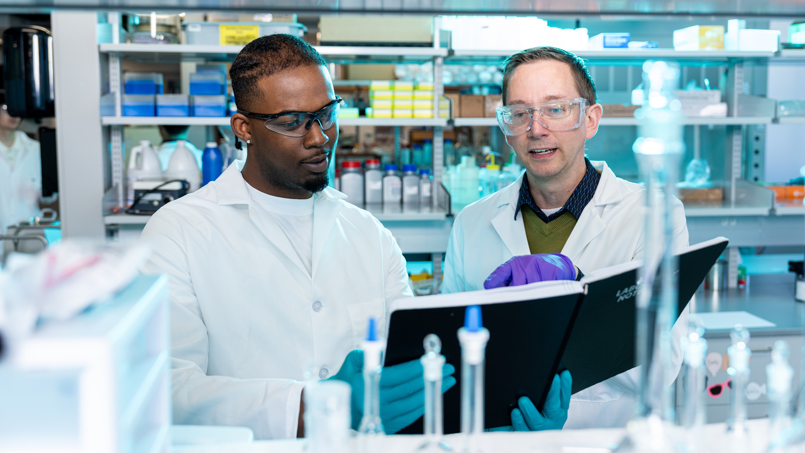 Sivey working with a student in his Aqueous Environmental Chemistry Laboratory 