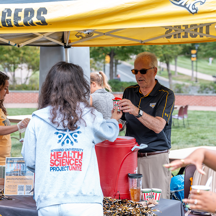 President Ginsberg handing out ice cream