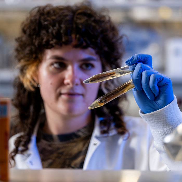 One of Krista Kraskura students studies a preserved juvenile striped bass