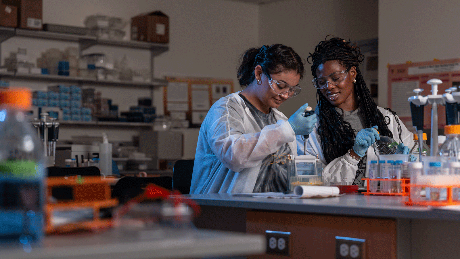 Students in biology CURE program pipetting proteins