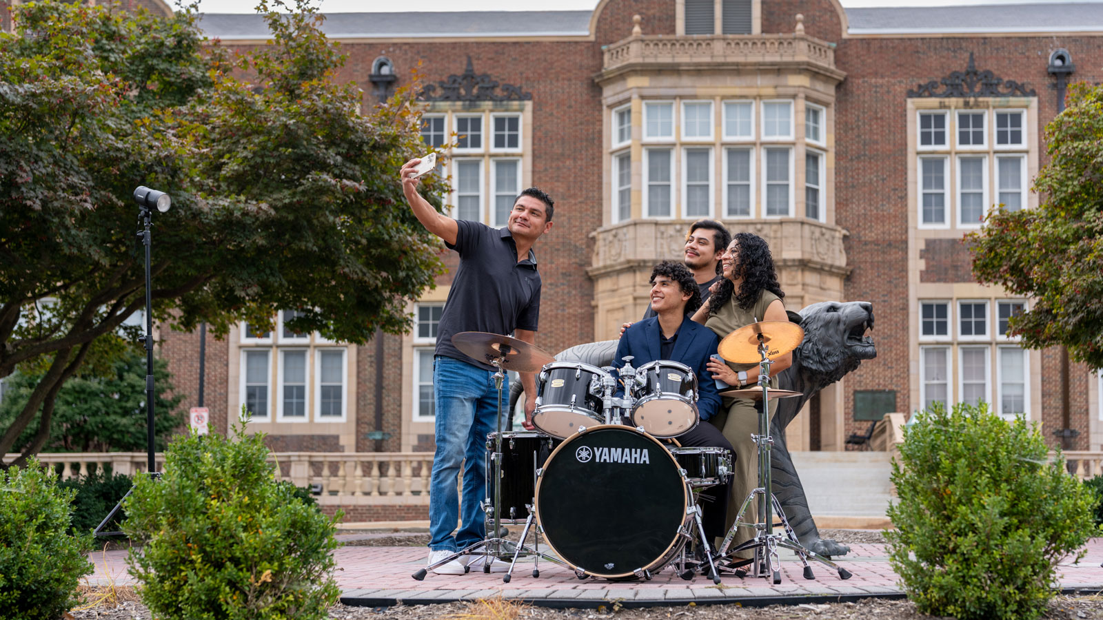 Brandon Reyes taking a selfie with members of his family 