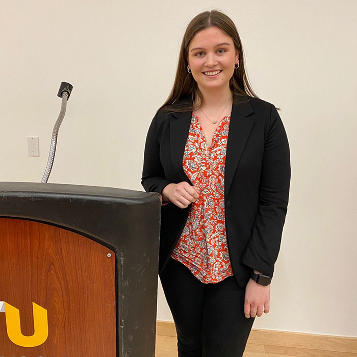 Cailie at a podium