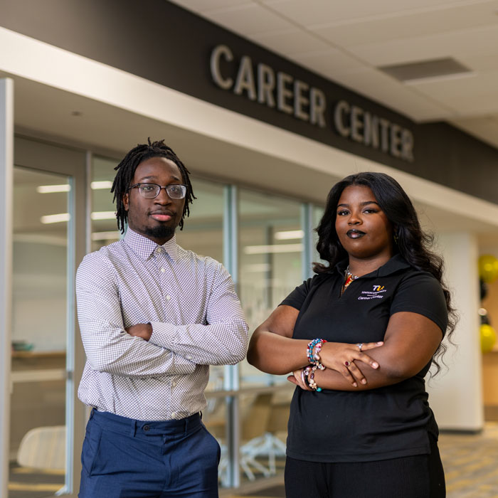 Two Career Center student employees stand outside of the Career Center