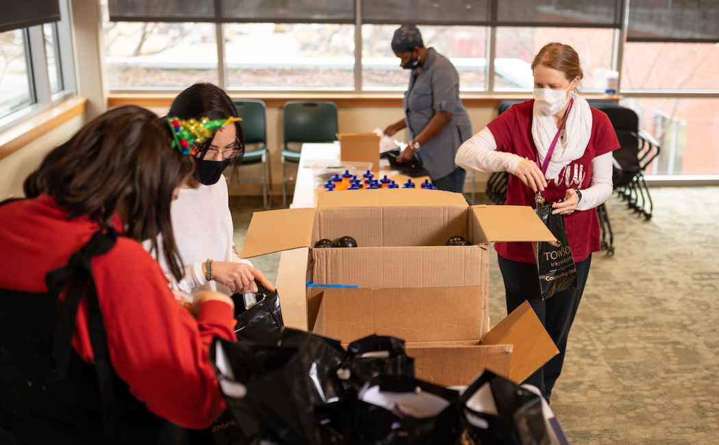 Volunteers from the TU Counseling Center and Center for Student Diversity assemble care packages