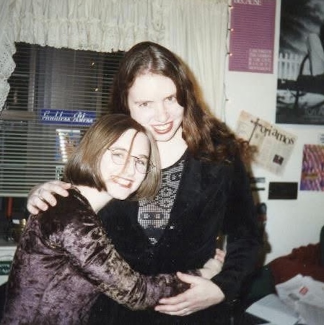 Two students hugging