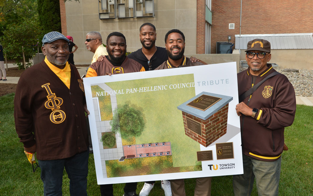Members of Iota Phi Theta hold a rendering for the NPHC Tribute Project
