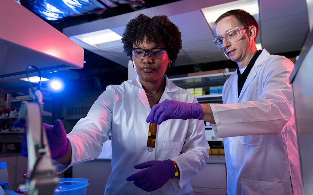 Student and professor in lab