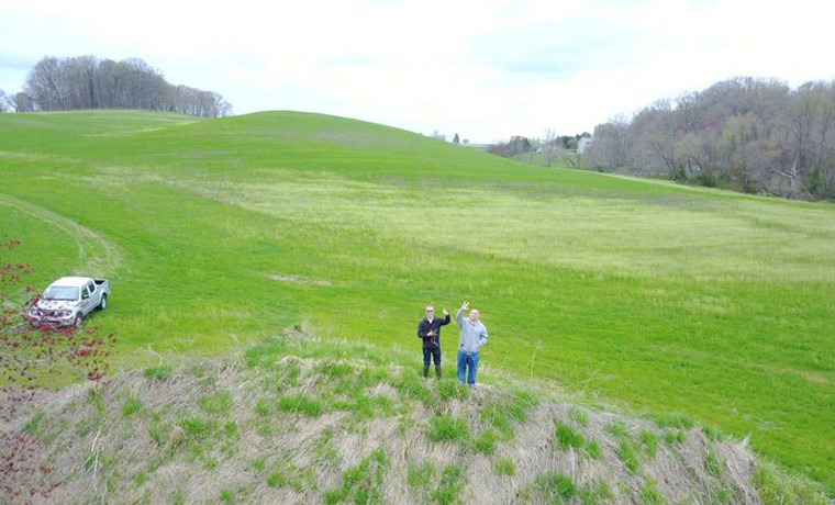 Two men in a field aerial