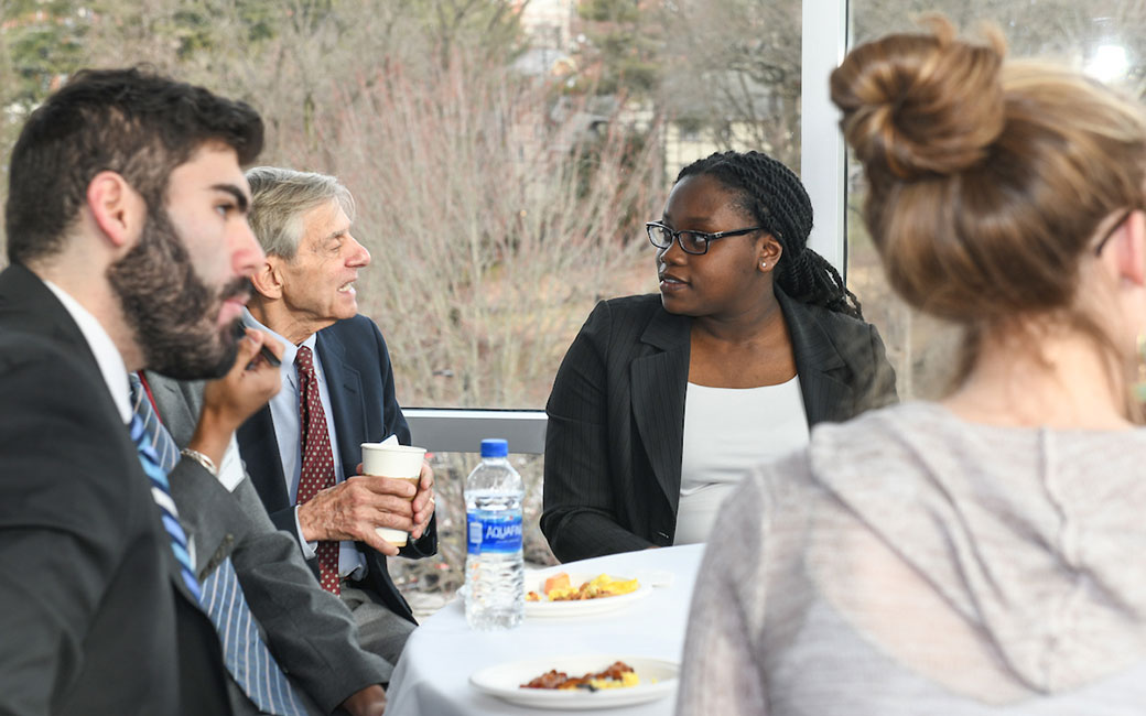 Students sitting at table talking