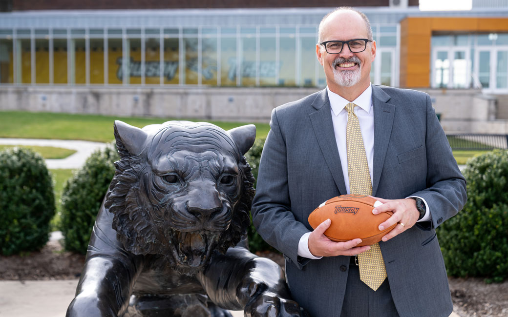 TU football coach Pete Shinnick with the Tiger statues