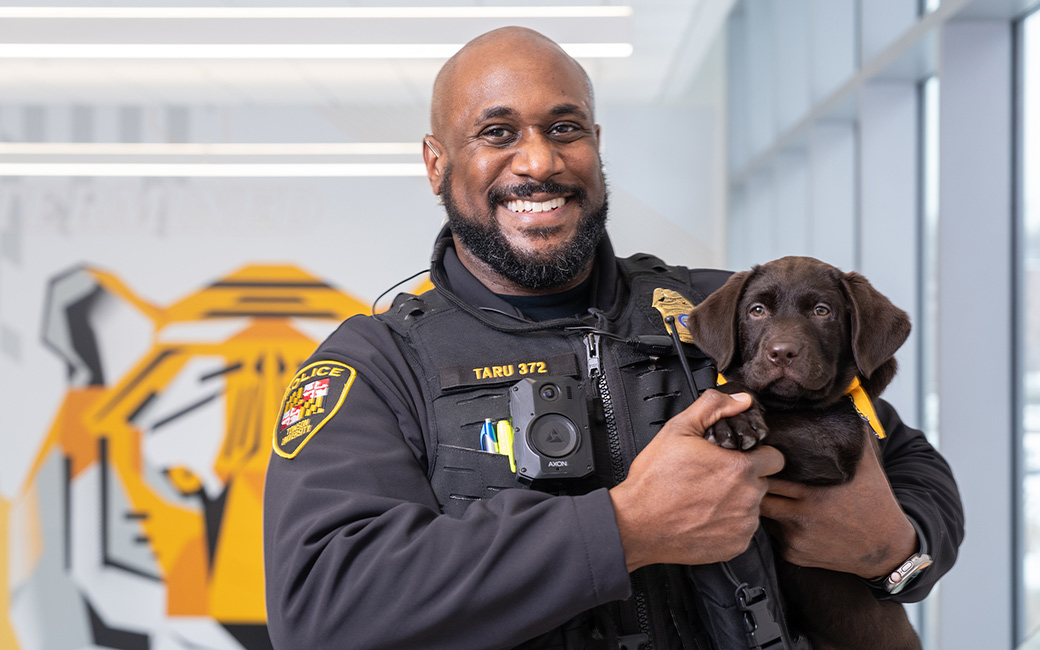 TU's new comfort dog with his TUPD handler