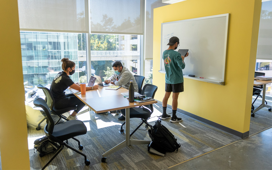 Three students in a study area in the new Science Complex