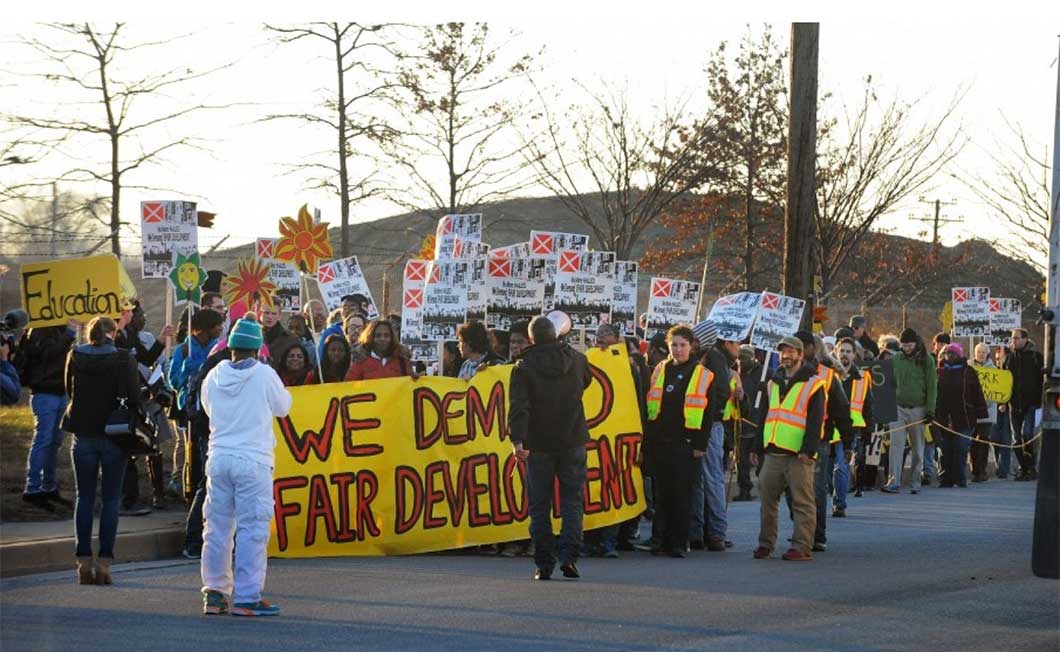 About 100 Franklin High School students, community activists and union members march in late 2013 to the site of the highly contested incinerator as part of a campaign to stop its construction in Curtis Bay. (Kenneth K. Lam/Baltimore Sun)