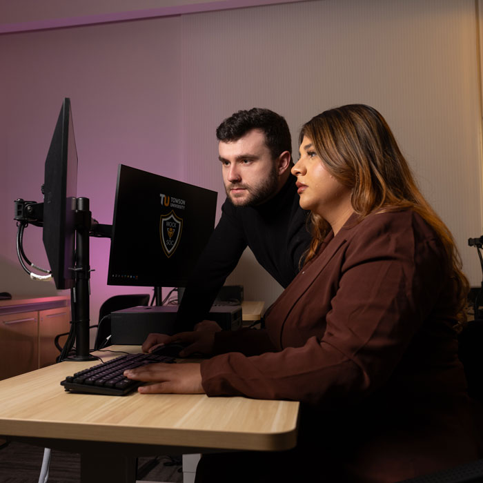 TU students working on a computer