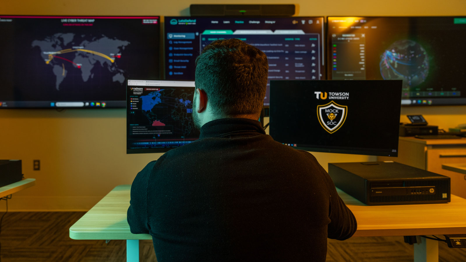 A student doing research in one of TU's Cybersecurity lab