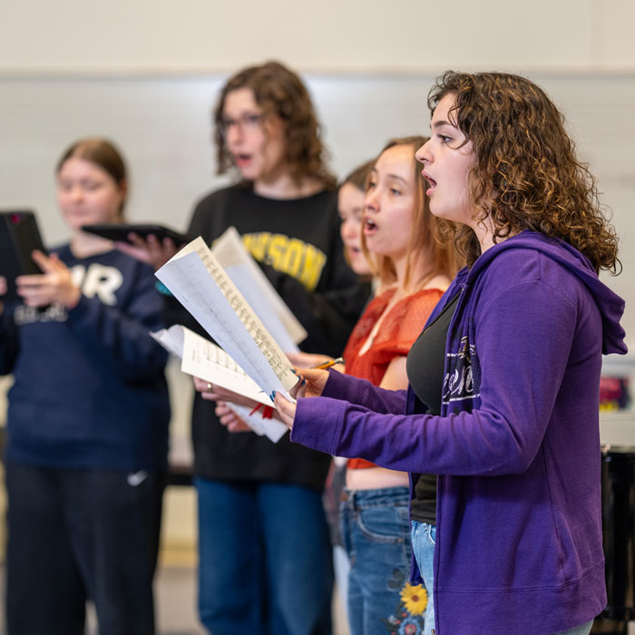 Students rehearsing in Professor Sáez' Chorale Ensemble course