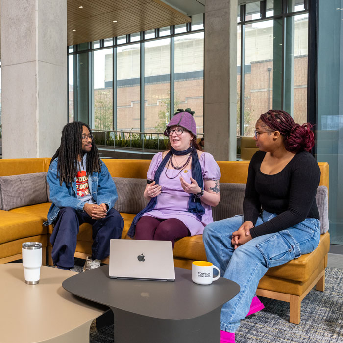Students involved with the Office of Accessibility & Disability Services chat in the Health Professions building
