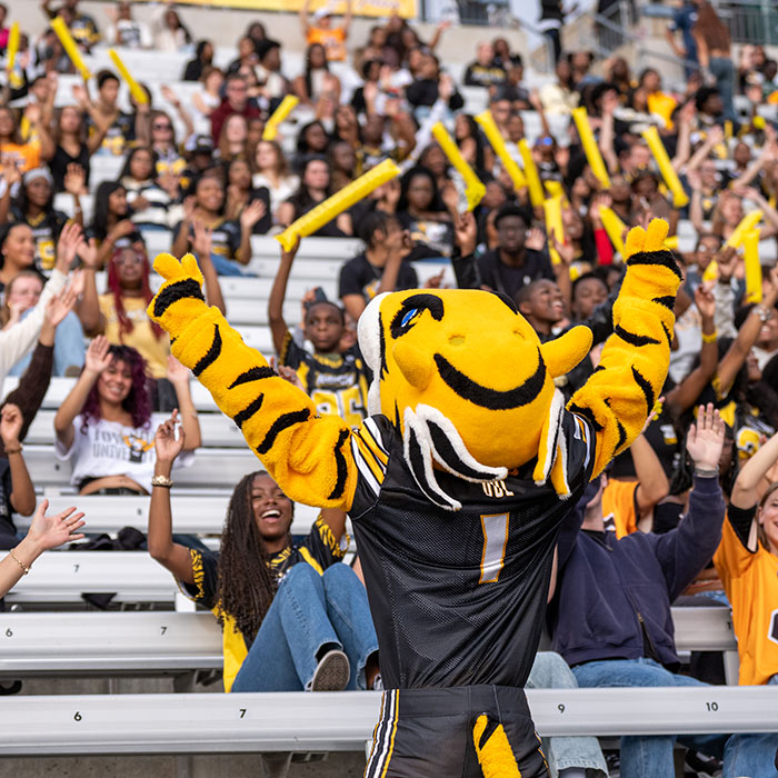 Doc the Tiger rallying the TU student section at a previous Homecoming game