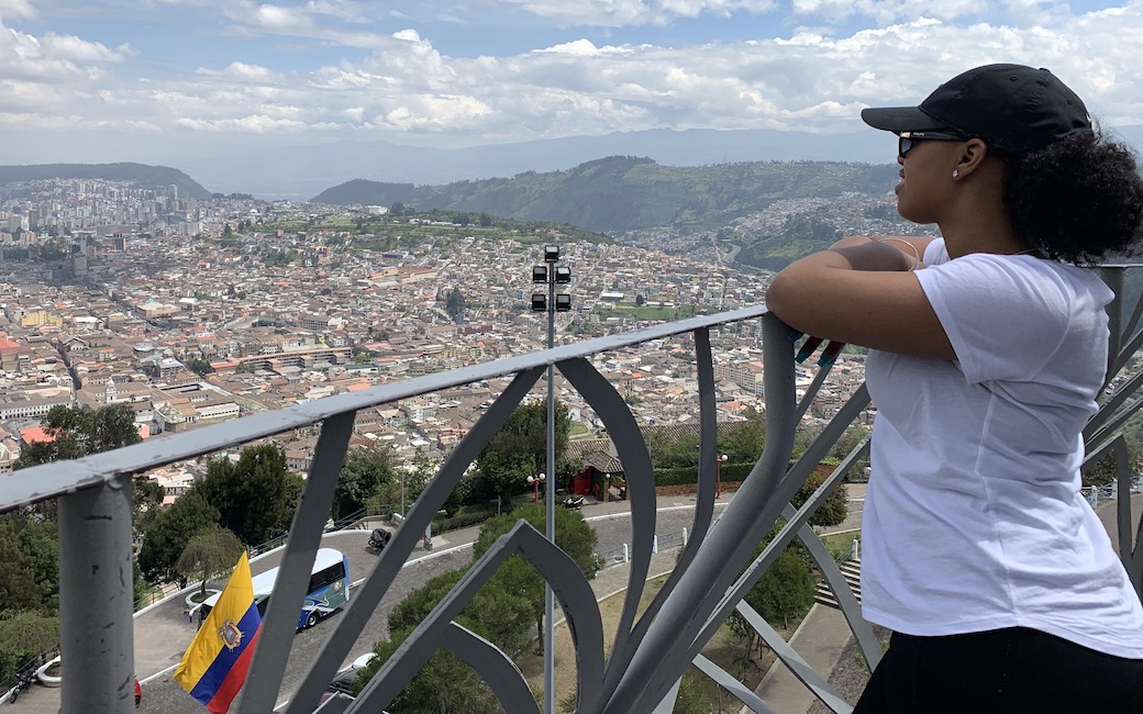 Female student and Ecuadorian city scape