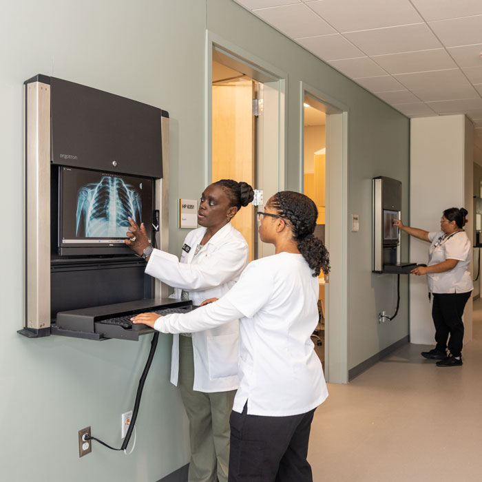 Students in health sciences view an x-ray screen in the Health Professions Building
