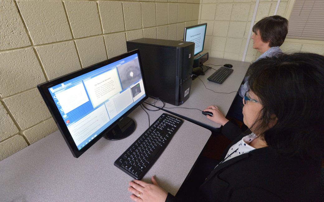 College of Education professors Maria Perpetua Liwanag (front) and Prisca Martens demonstrate the technology located in TU's EMMA Research Center. The center is one of only nine in the world.