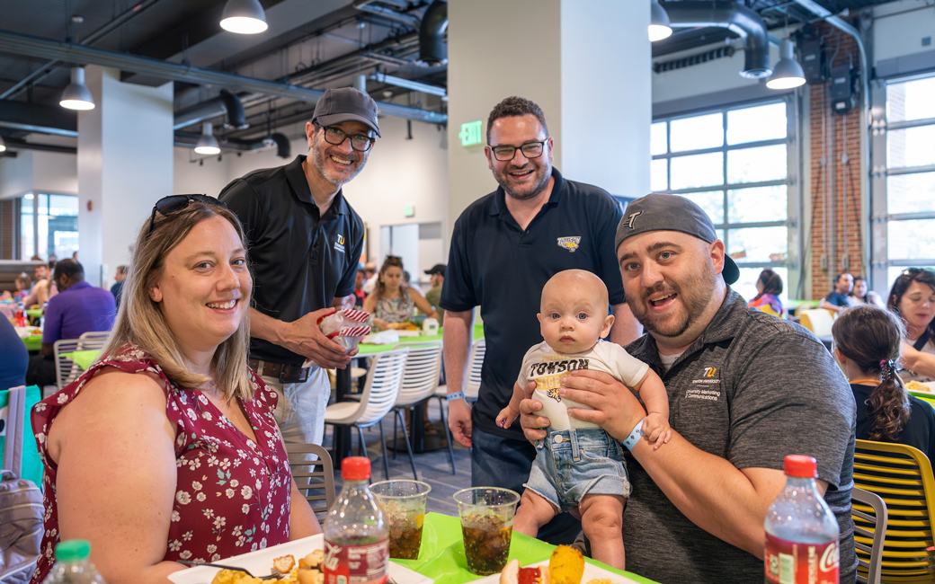 Staff members pose for the camera