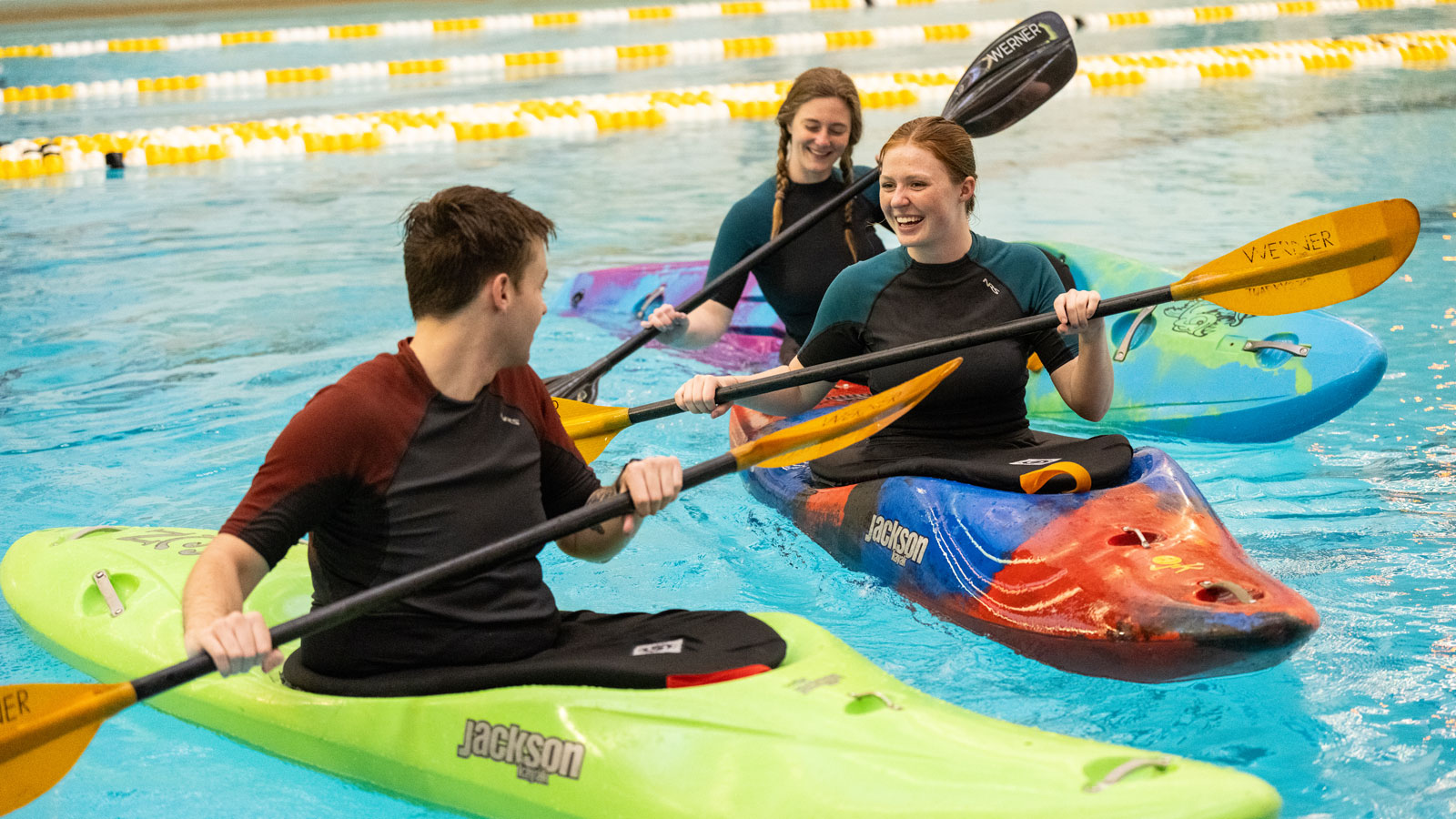 Huff and Krohn teach a kayaking class in the pool at Towson University's Burdick Hall. 