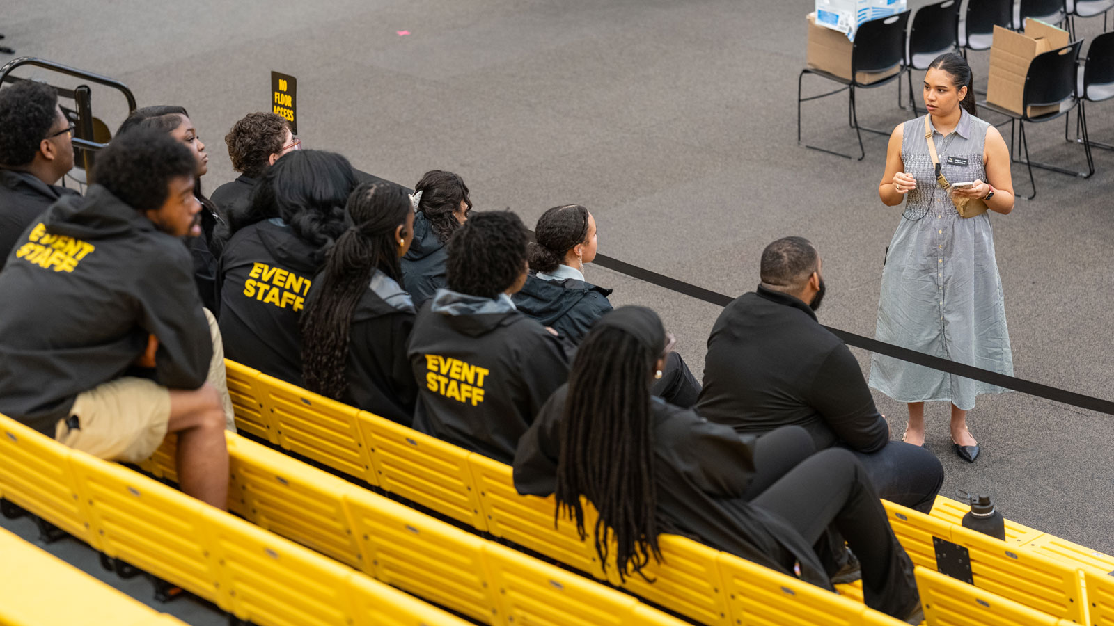 A meeting between ECS and their student employees before a high school graduation