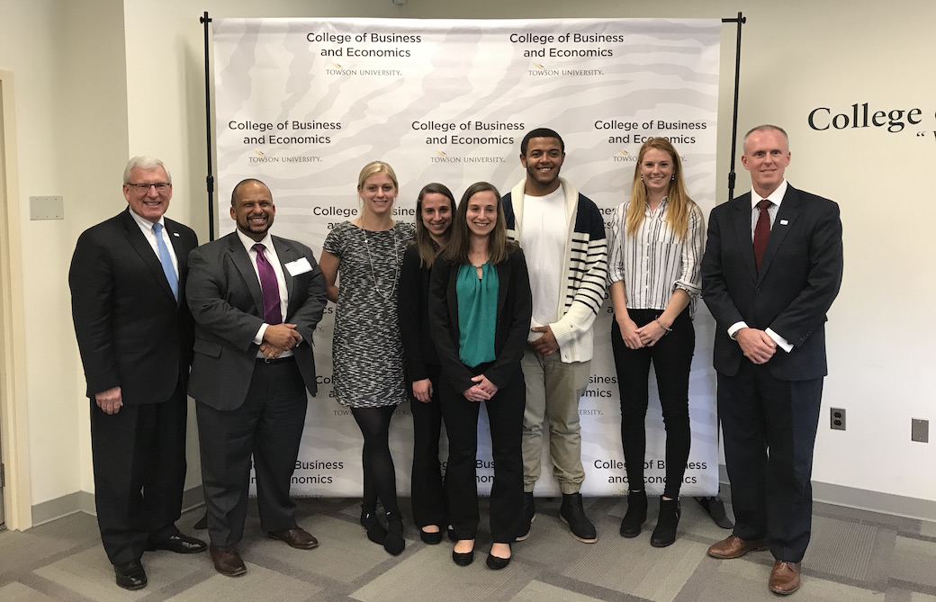 The winning team (center) of Madison Bove, Meredith and Meghan Price, Amos Campbell and Renate Van Oorschodt with members of SECU's judges' panel.