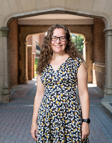portrait in front of brick archway