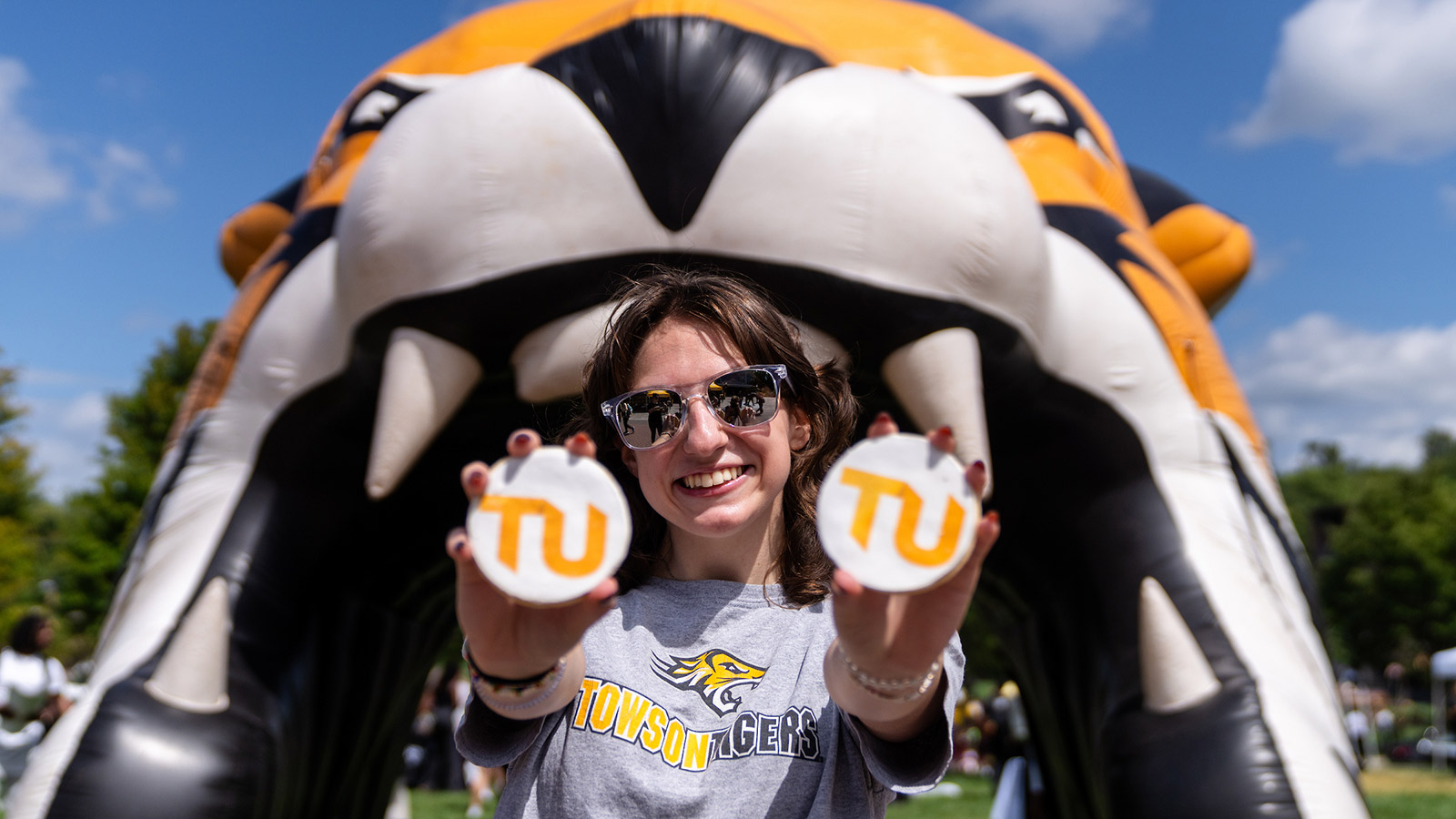 staff handing out giveaways at the tiger tuesday bash