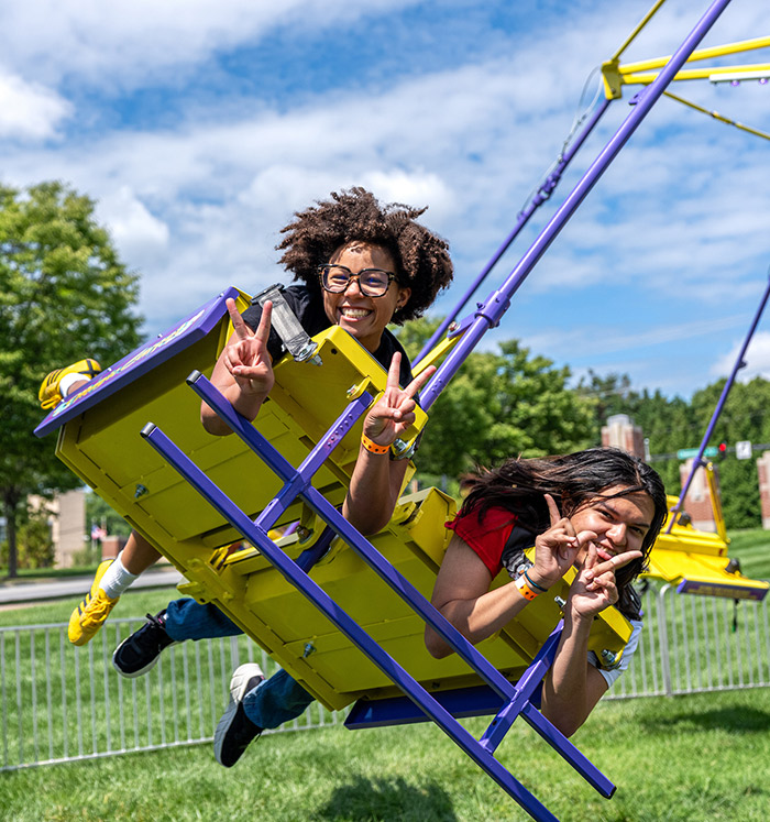 students riding on a carnival ride