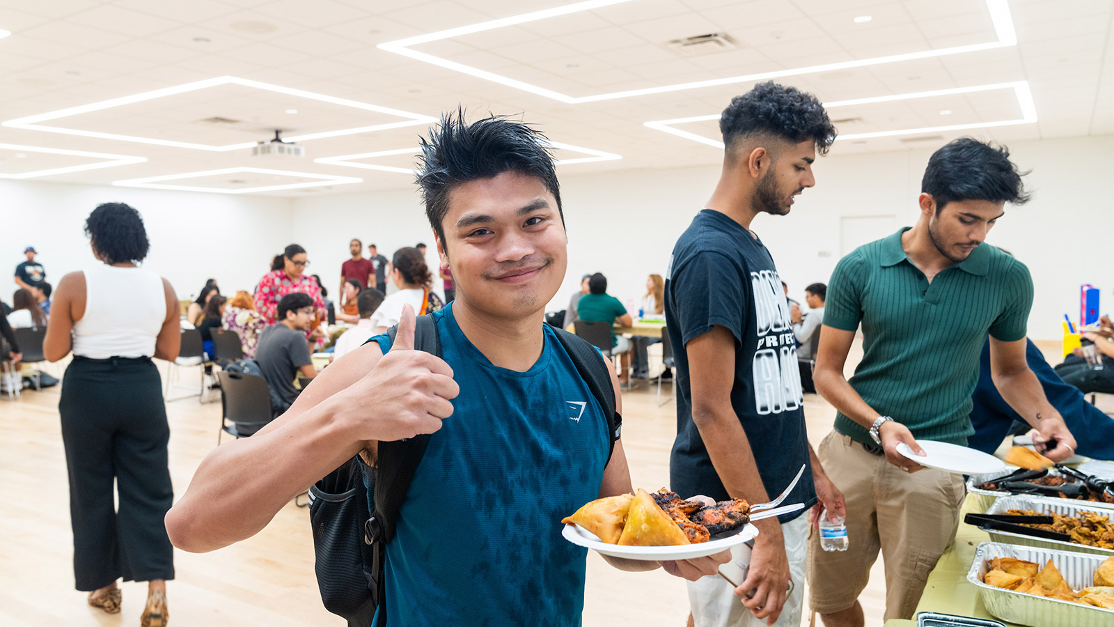 student with a plate of food 