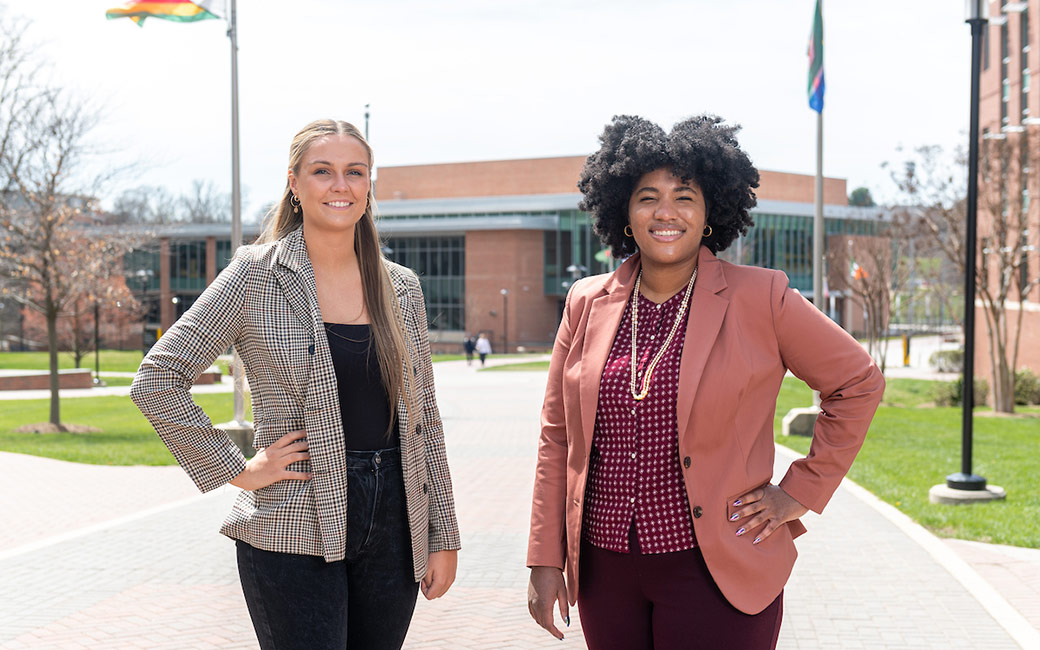 Two students posing on Liberal Arts International Walkway