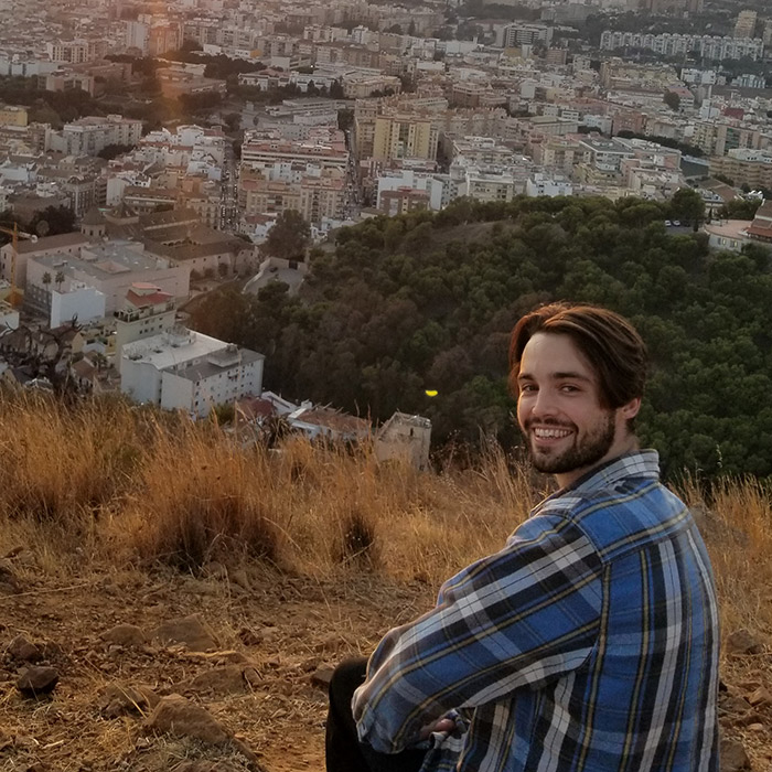 Student in front of scenic overlook