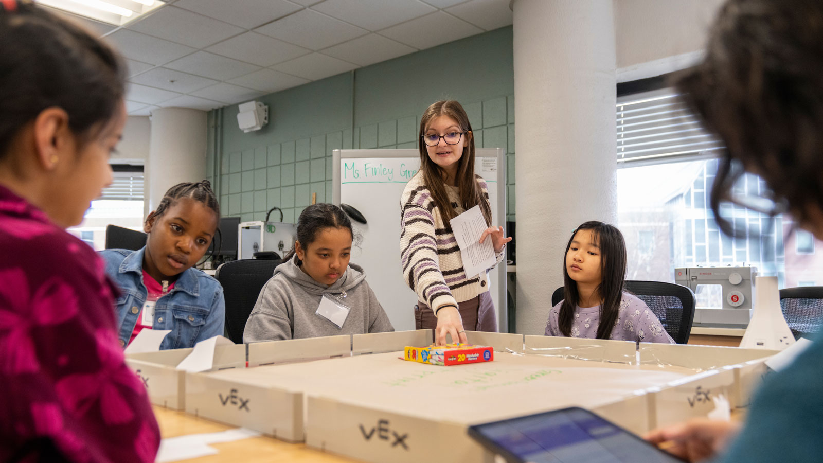 TU Student Finley Curtis helps students during an exercise.