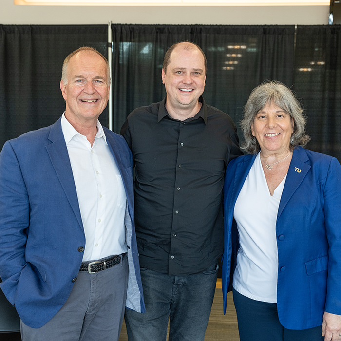 Greg Faller and two people standing