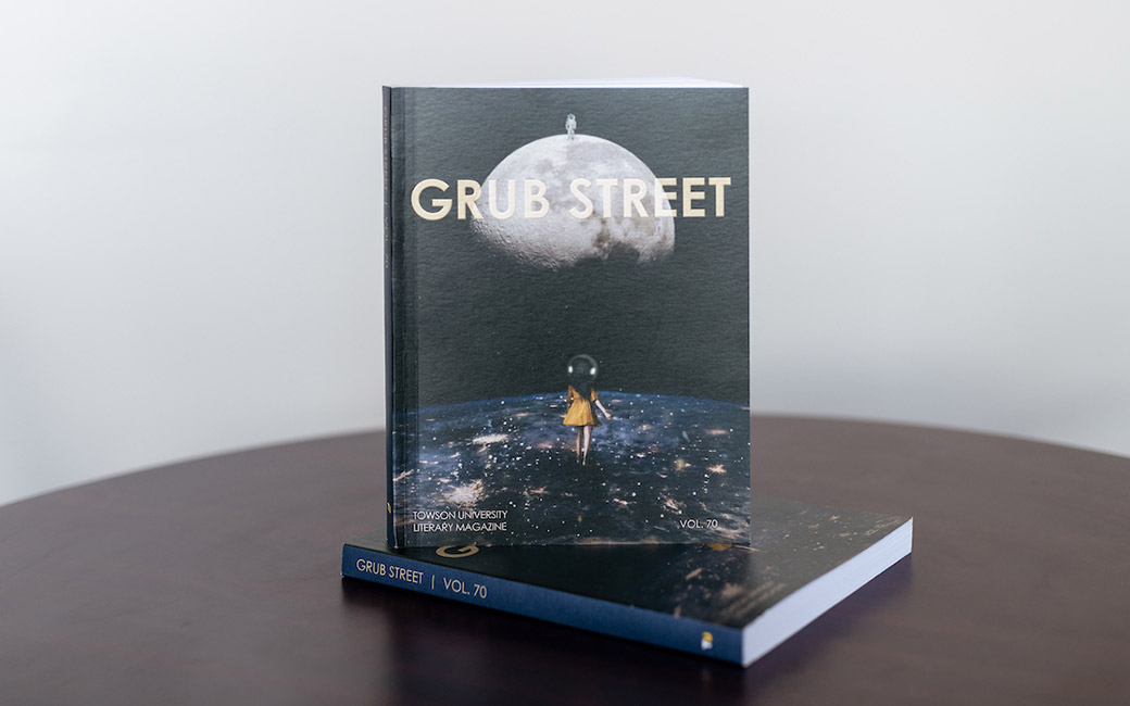 Literary journals stacked on table