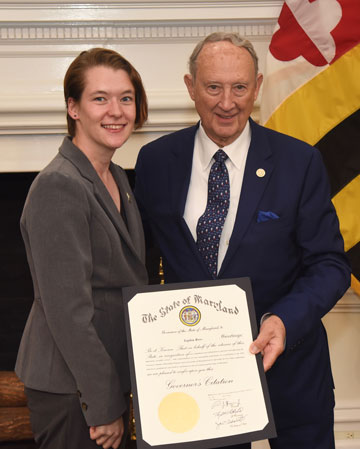 Sophia Ross poses alongside Maryland Secretary of State John Wobensmith