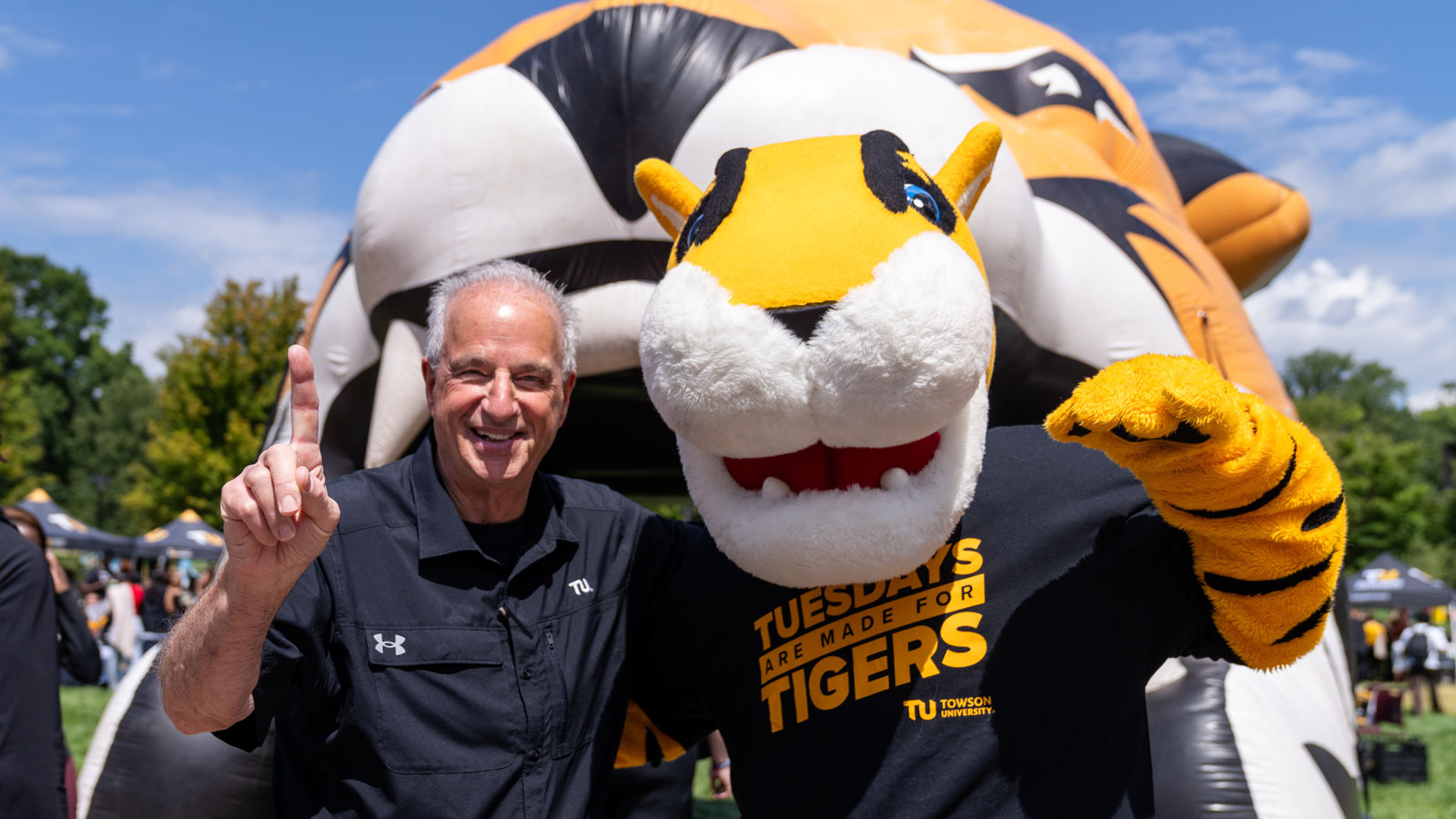 A photo of Towson University President Mark Ginsburg and Doc The Tiger