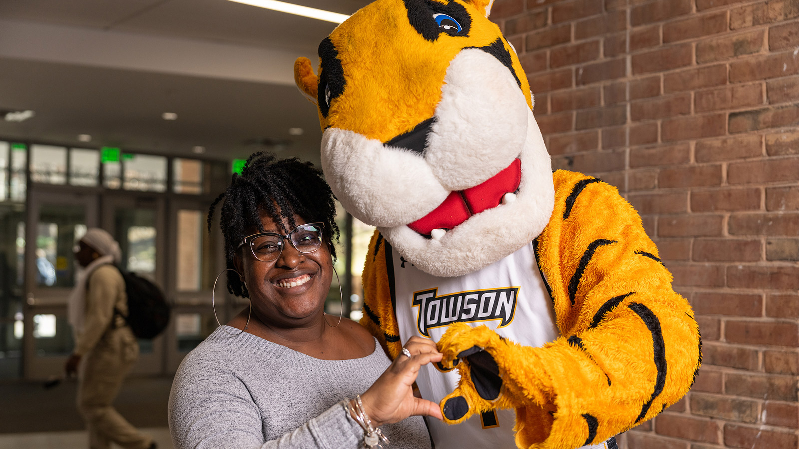 a tu staff member hugging doc