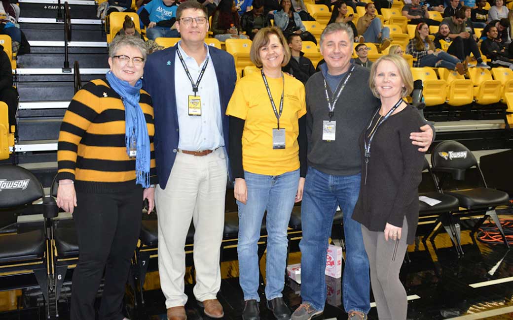 (From left:) TU President Kim Schatzel, Athletic Director Tim Leonard, Hussman Center Director Cathy Clark, and John and Terri Hussman at the 2018 autism awareness men's basketball game.