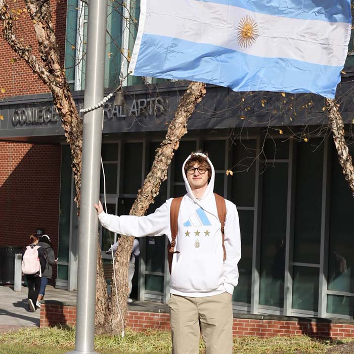 TU student with an Argentinian flag