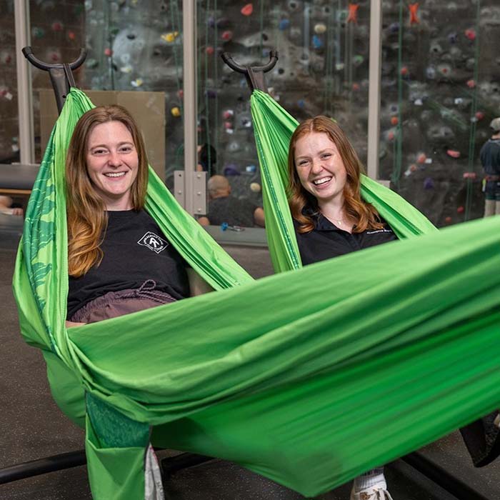 tu students in green hammocks at Burdick Hall