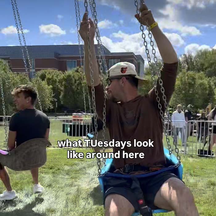 TU community members on a swing with the text overlay "what TUesdays look like around here"