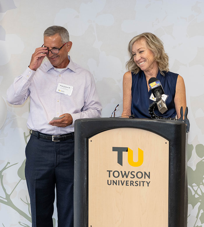 Doug and Therese Erdman giving remarks at podium