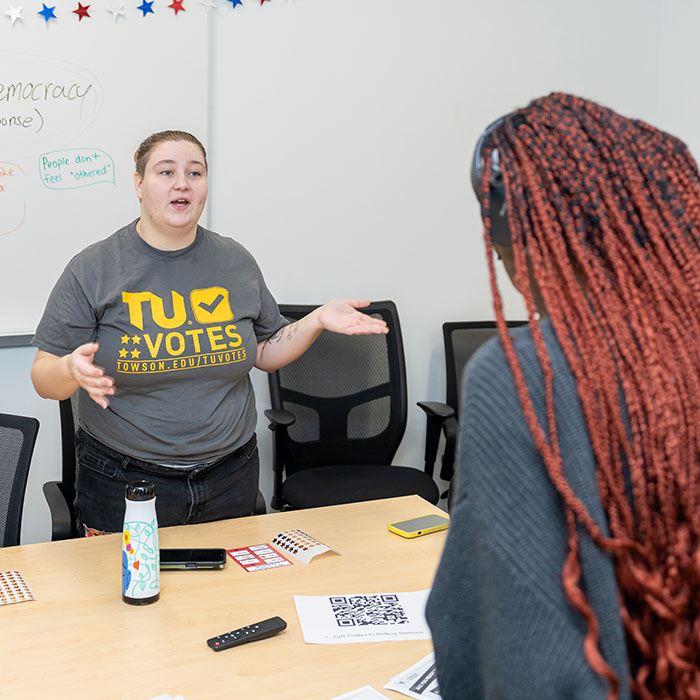 Student discussing voting